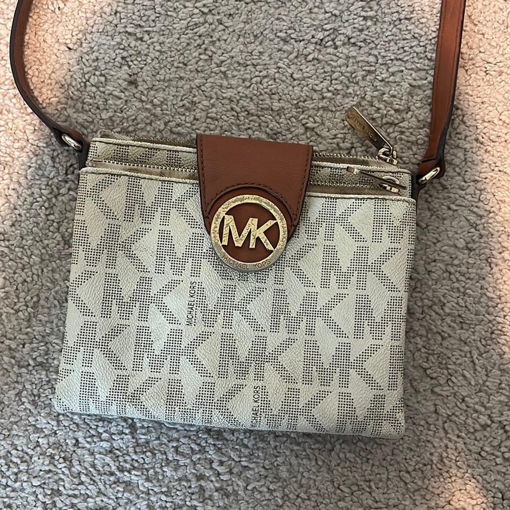 Well loved real MK purse sadly with lipstick stains on the inside